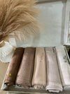 “Five cotton hijabs in gentle, natural shades, neatly packed in a gift box.”